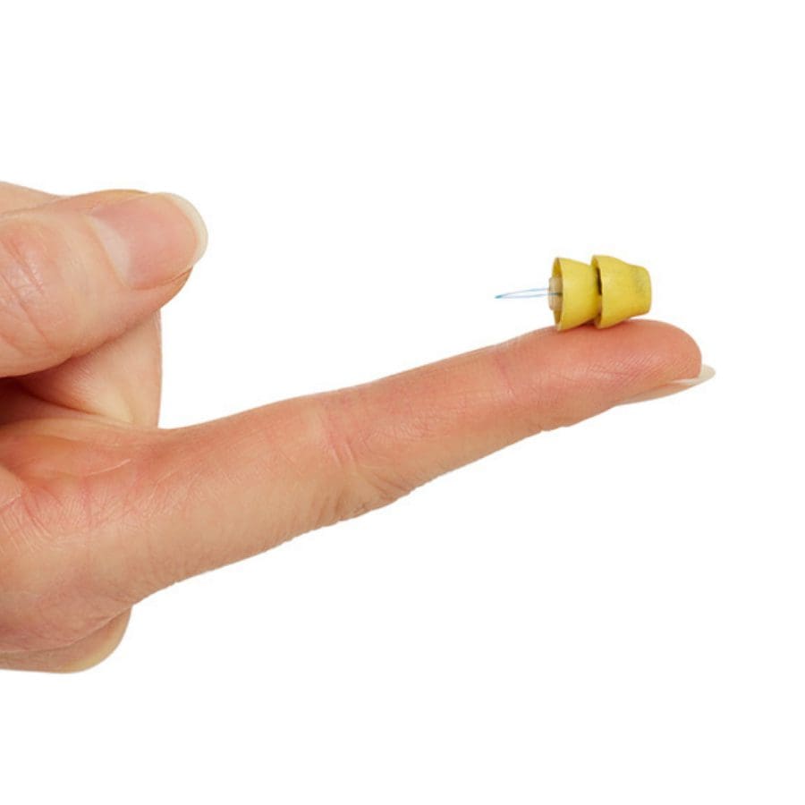 the lyric hearing aid rests on an index finger