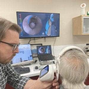 Our hearing aid specialist performs a 3D ear scan on a patient to make custom hearing aids.